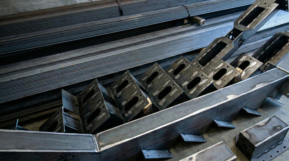 Welded steel stair stringer with laser-cut step brackets, ready to ship